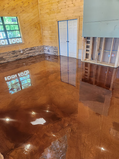 A room with a shiny floor and a window