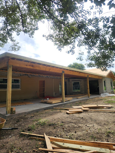 A house under construction in the middle of the day