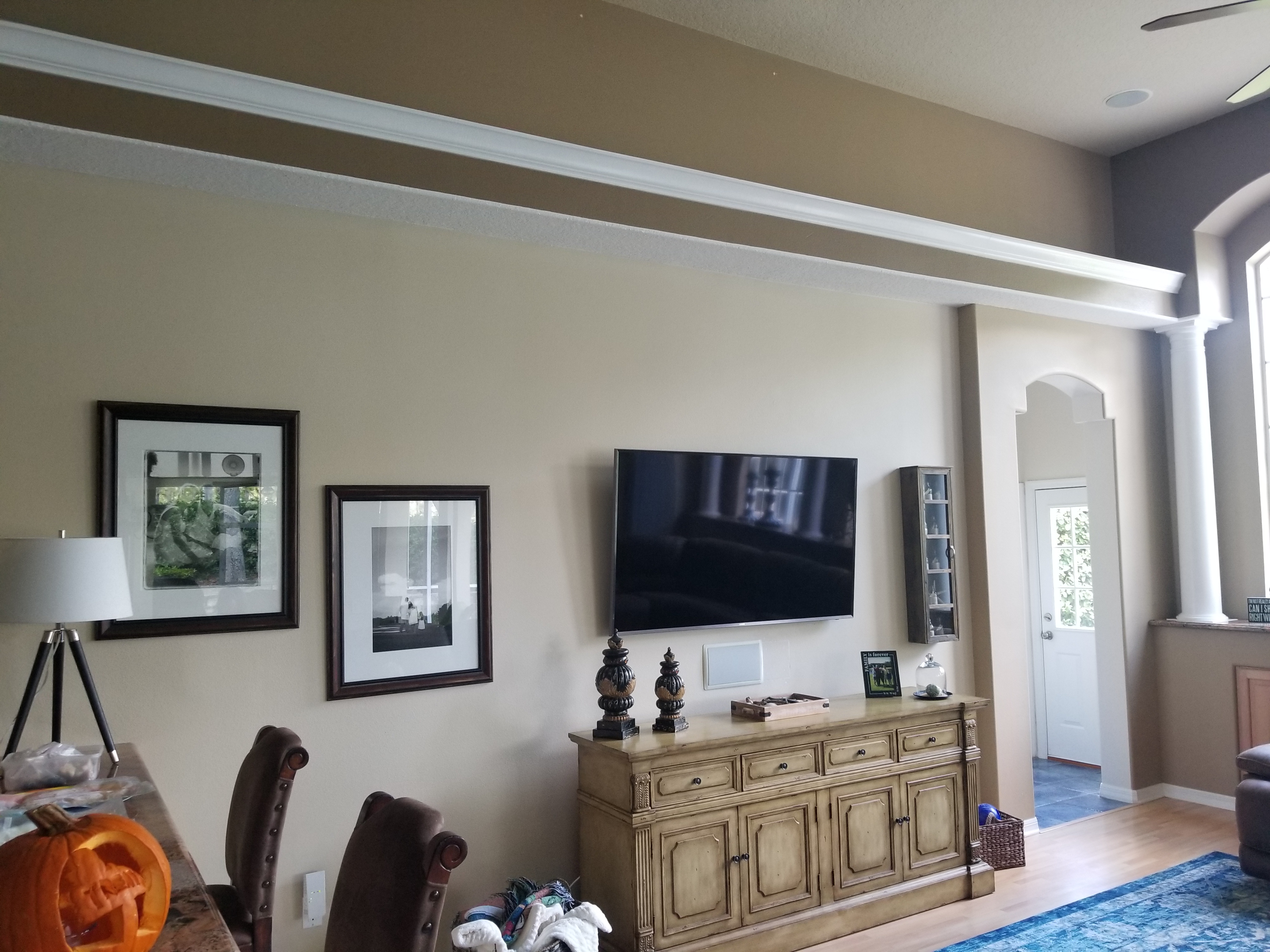 A living room filled with furniture and a flat screen tv